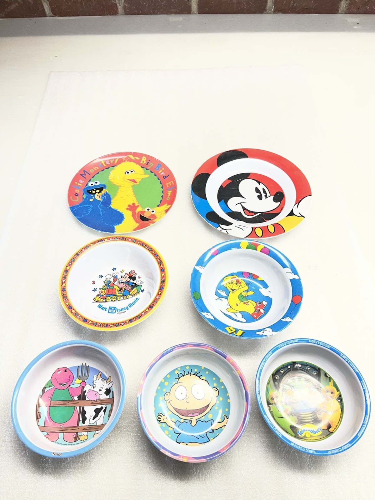 children\'s dinnerware items feature various popular cartoon characters