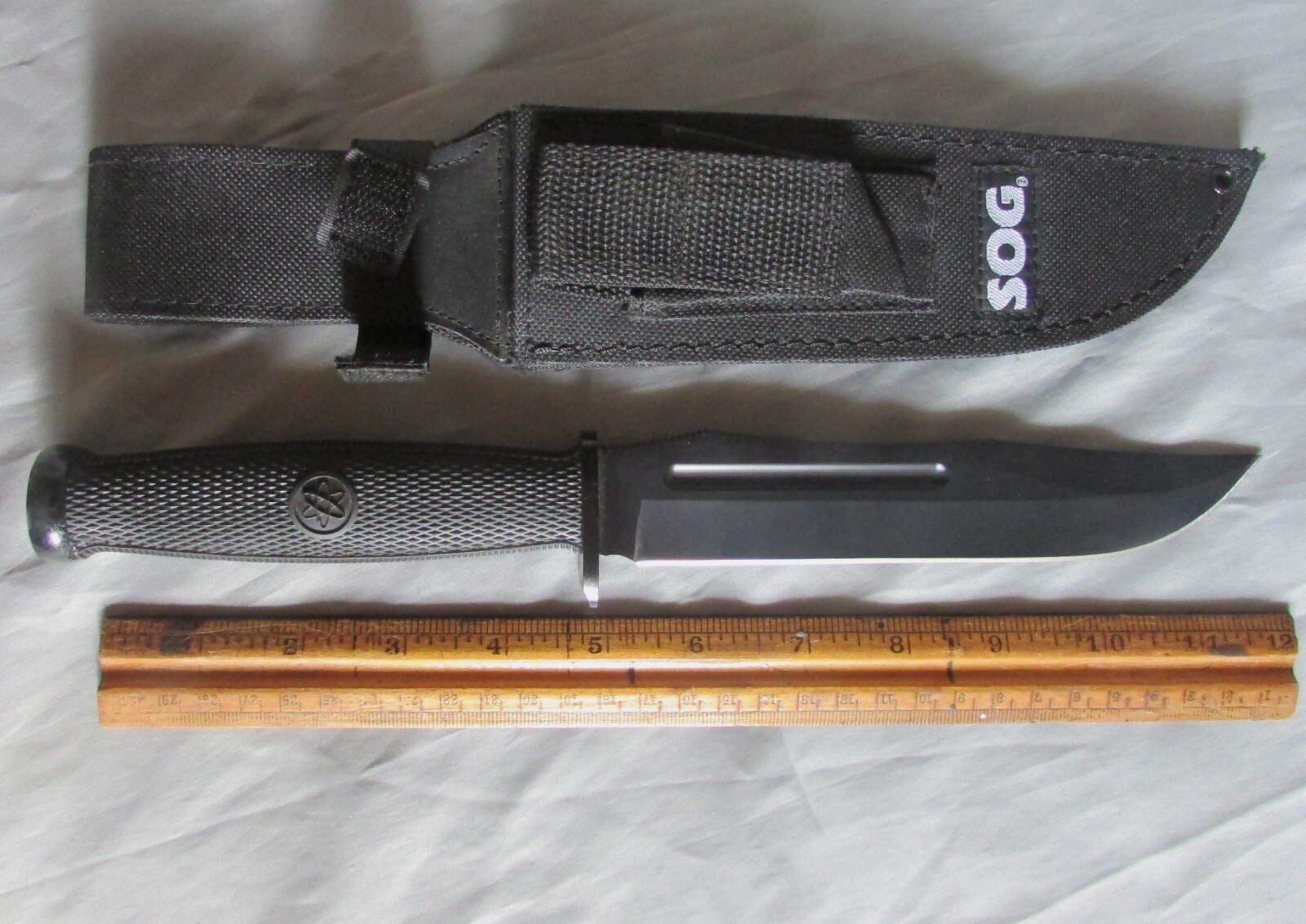 SOG Fixation fixed-blade Bowie knife, 7” blade sheath SOG Fixation fixed-blade Bowie knife, 7” blade sheath