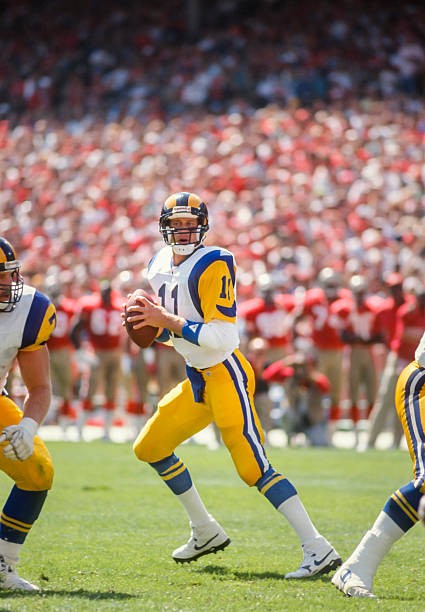 Jim Everett Los Angeles Rams attempts a pass during a National Foo- Old Photo 2