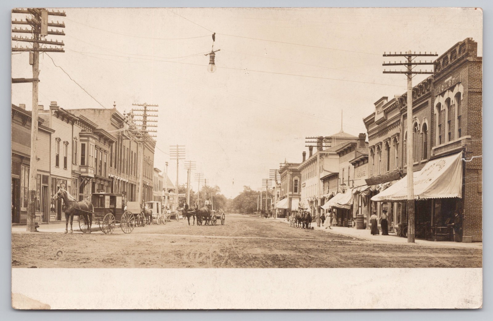 Oregon, Illinois RPPC c.1905 Street Scene Horses Wagons People Signs Lights UDB