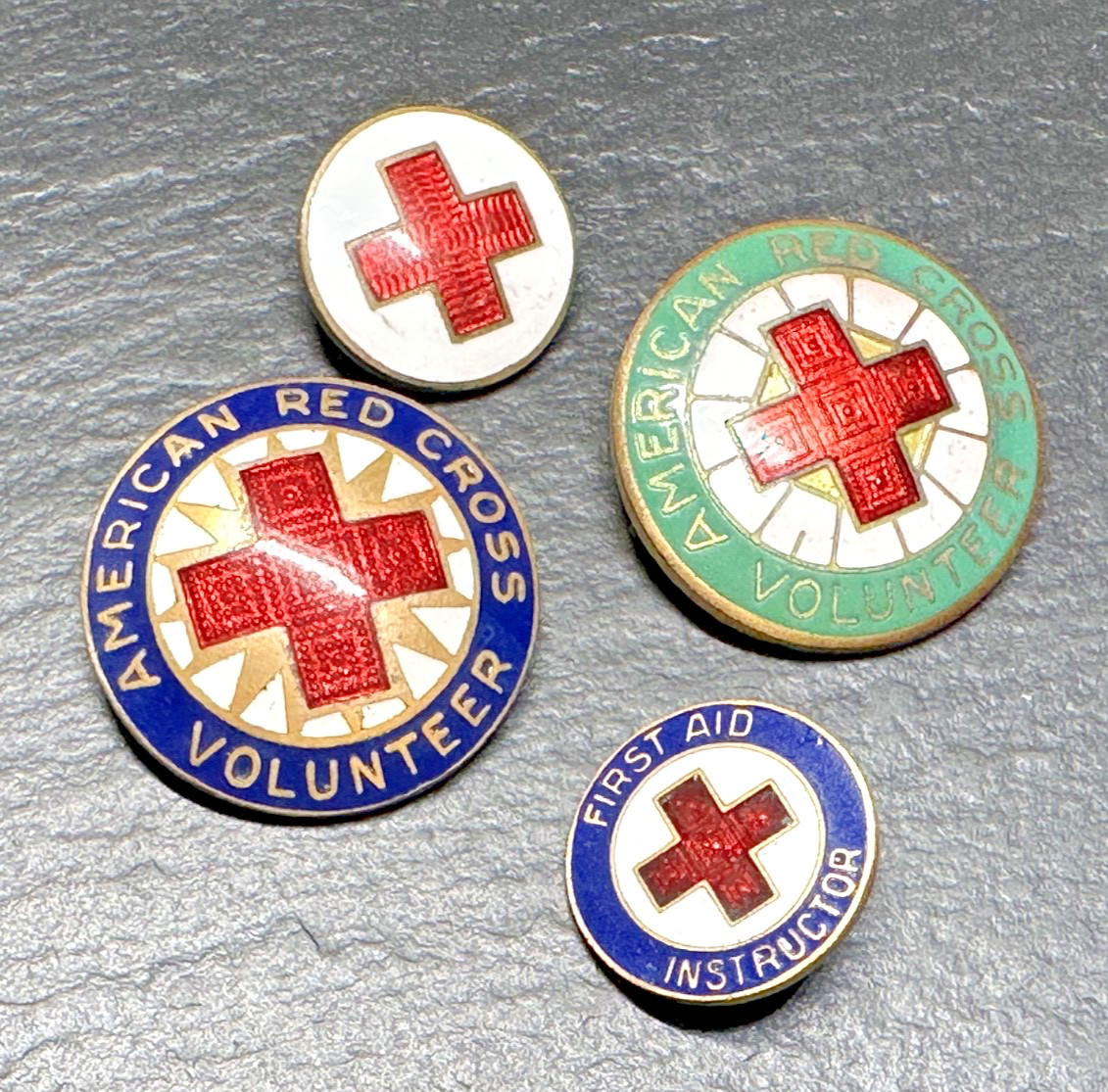 FOUR DIFFERENT VINTAGE RED CROSS PINS H876