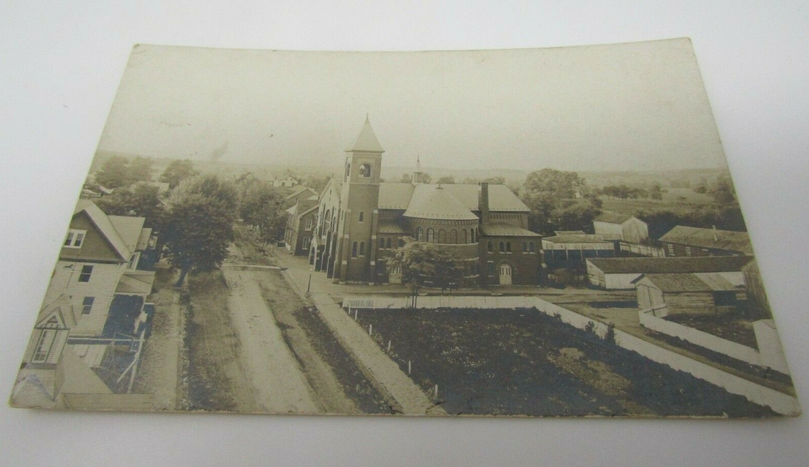 Unknown Town View Large Brick Church RPPC Real Photo Postcard Undivided Back Era