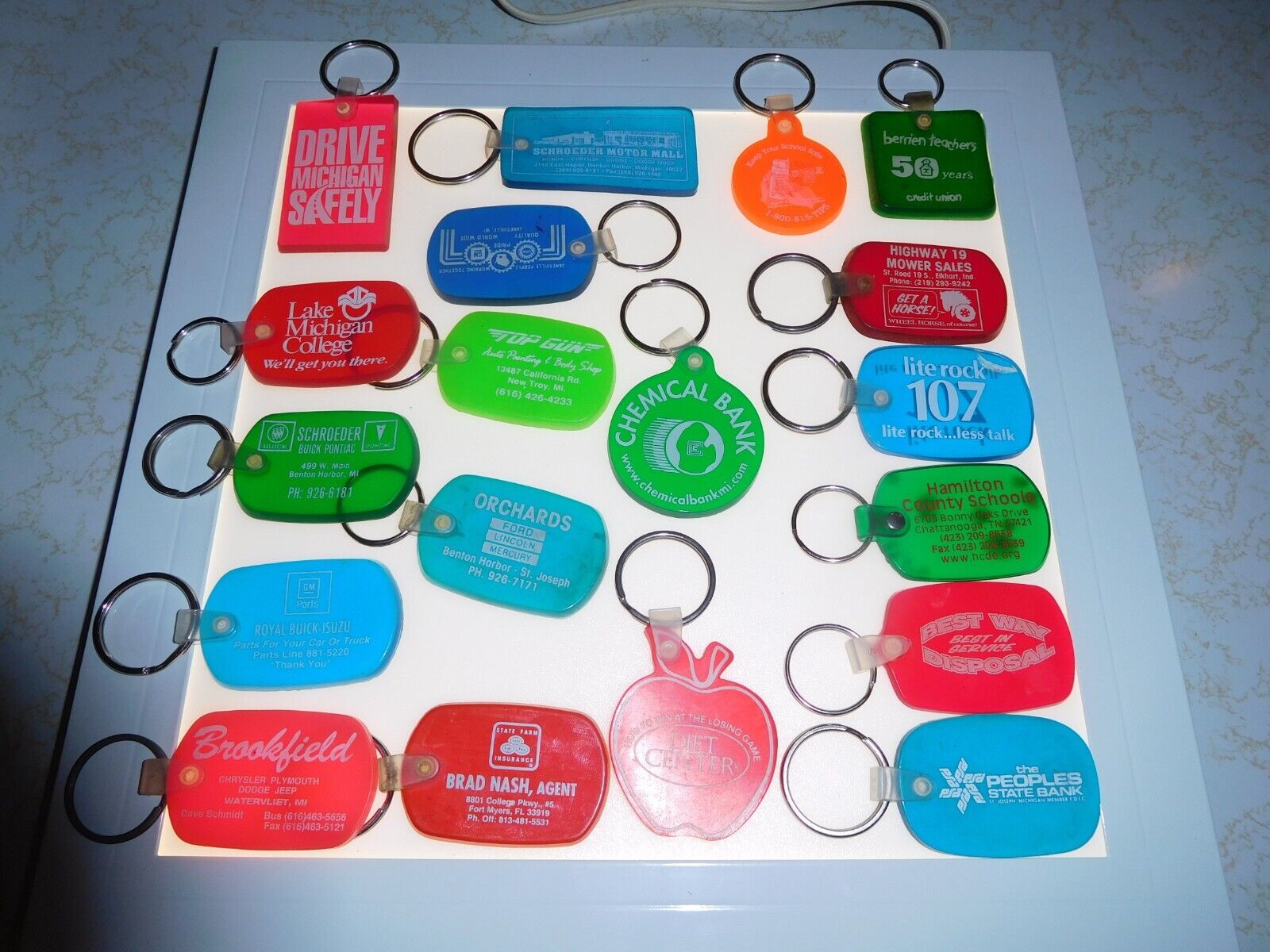 19 Vintage Colored Southwest Michigan Translucent Rubber Advertising Key ChainsB