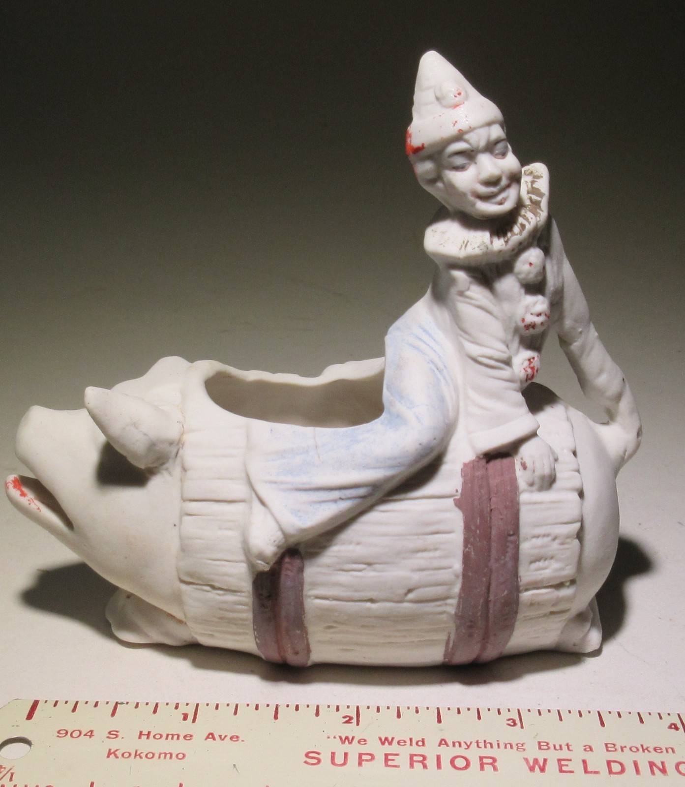 Vintage bisque pig in barrel with clown vase