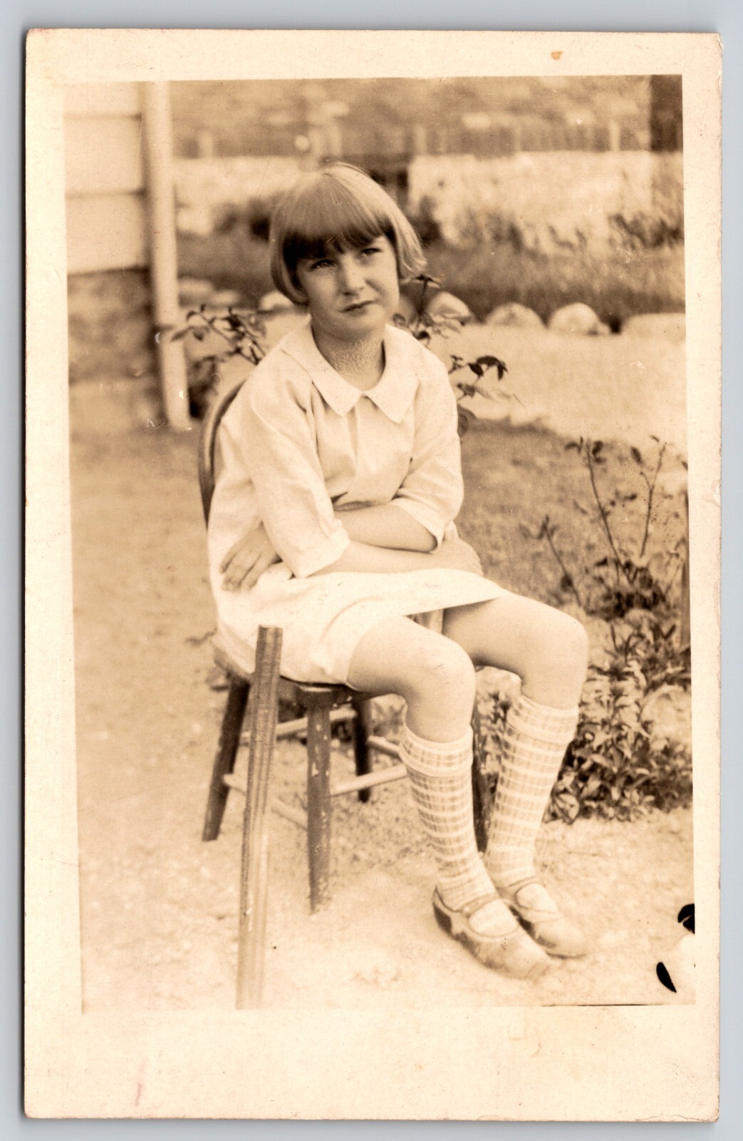 Postcard RPPC Young Girl Seated on Chair in Garden Real Photo Bangs
