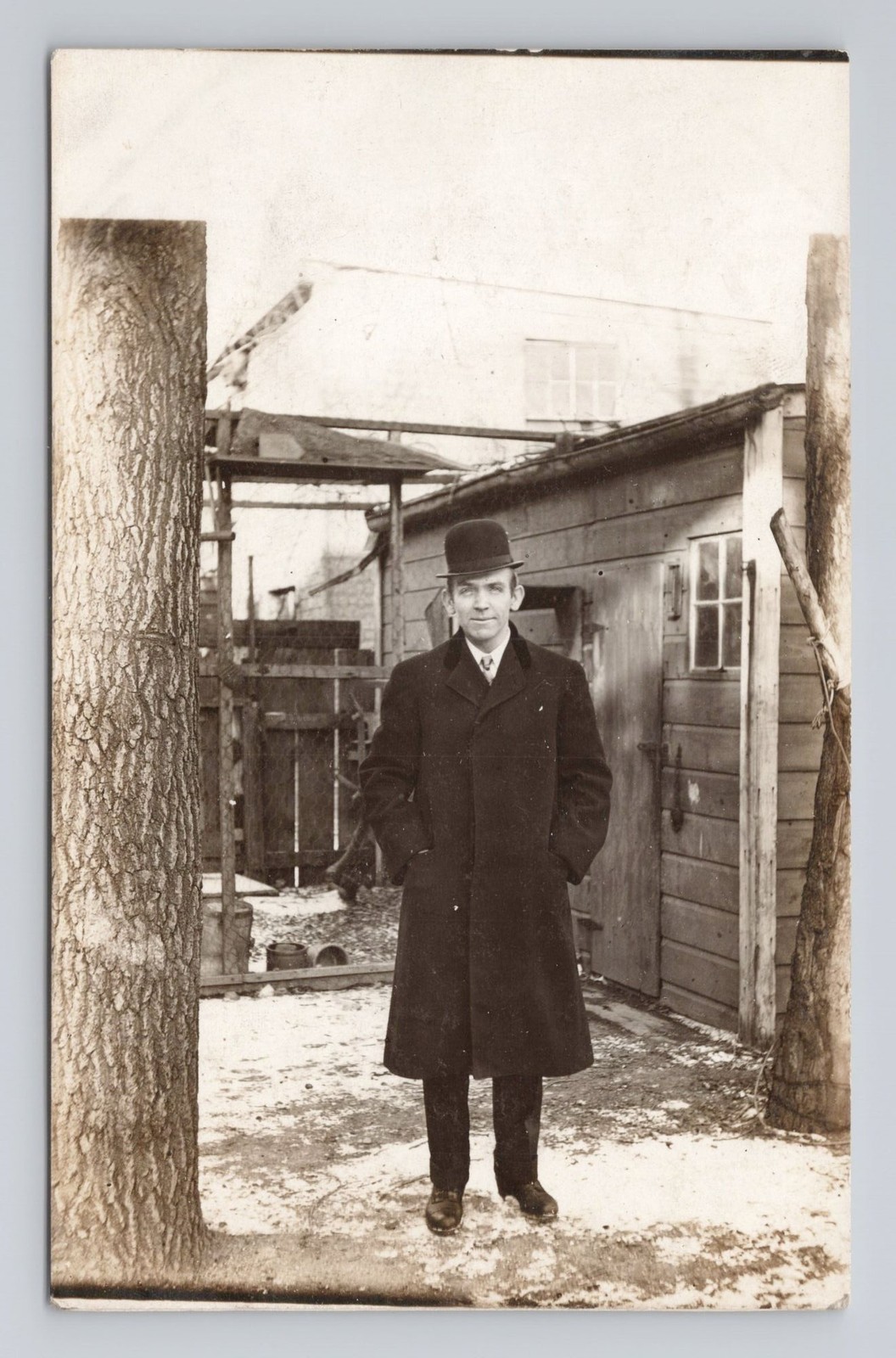 Antique RPPC  c. Early 1900s Dapper Man Bowler Hat Long Winter Overcoat Snow