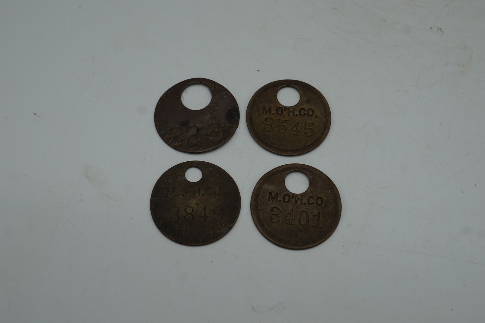 Vintage M.O\'H.CO. Numbered Industrial Tags - Lot of 4 Bronze Metal Tokens