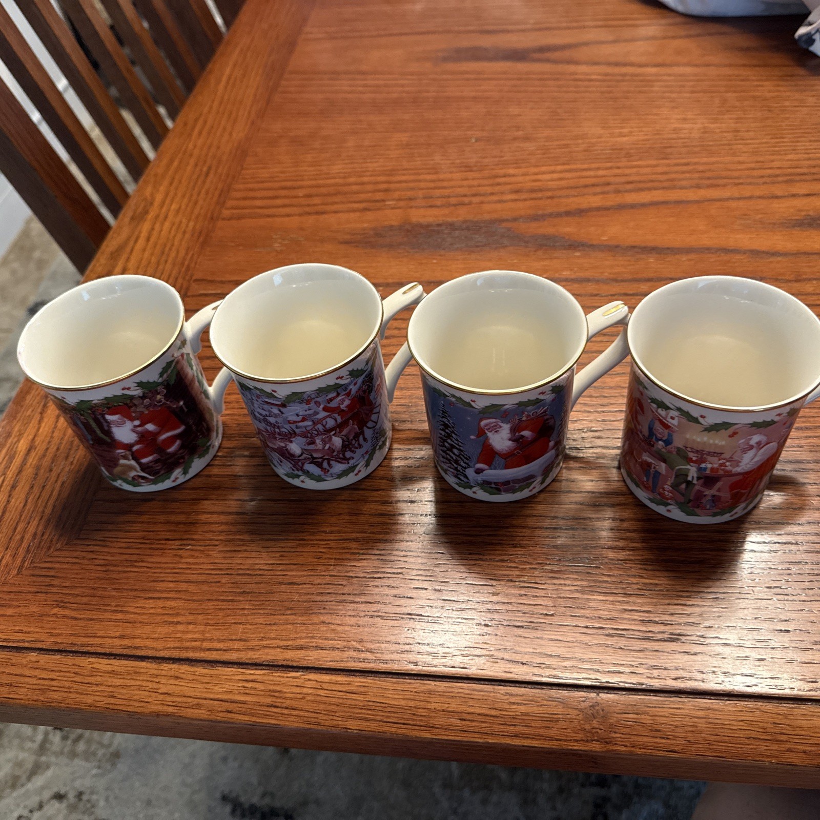 4 LENOX Christmas Mugs “SANTA’S HOLIDAY JOURNEY.” No boxes.  Never used. 