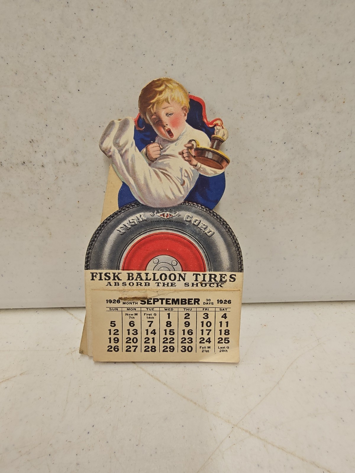 Antique 1926 Fisk Balloon Tires Advertising Die Cut Easelback Calendar Sign