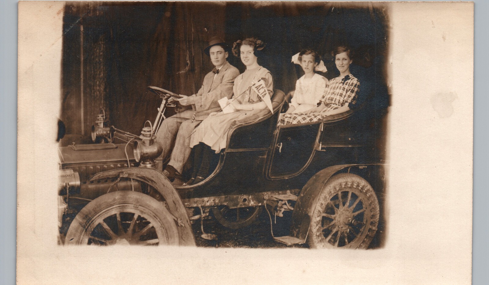 RIDING A SILLY PROP CAR alta ia? il? ca? wv? ut? wy? real photo postcard rppc