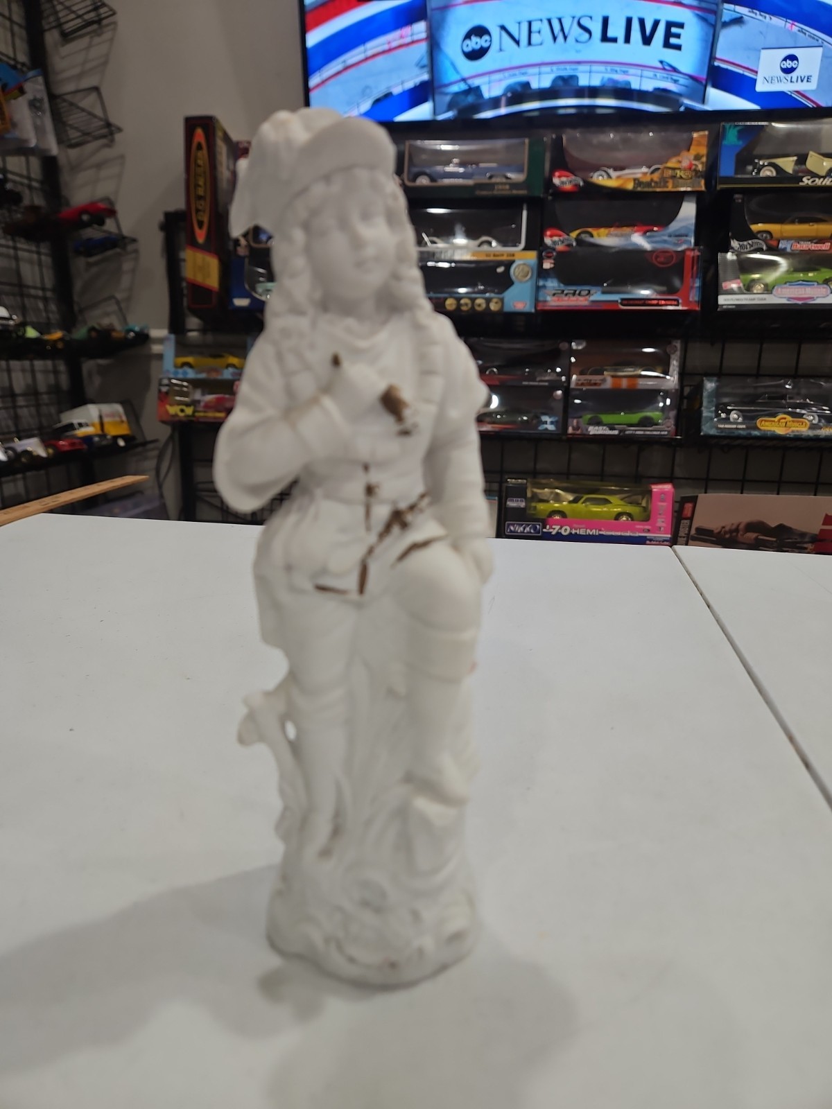 Vintage 8.75” Japanese bisque porcelain figurine in the 18th-century style.