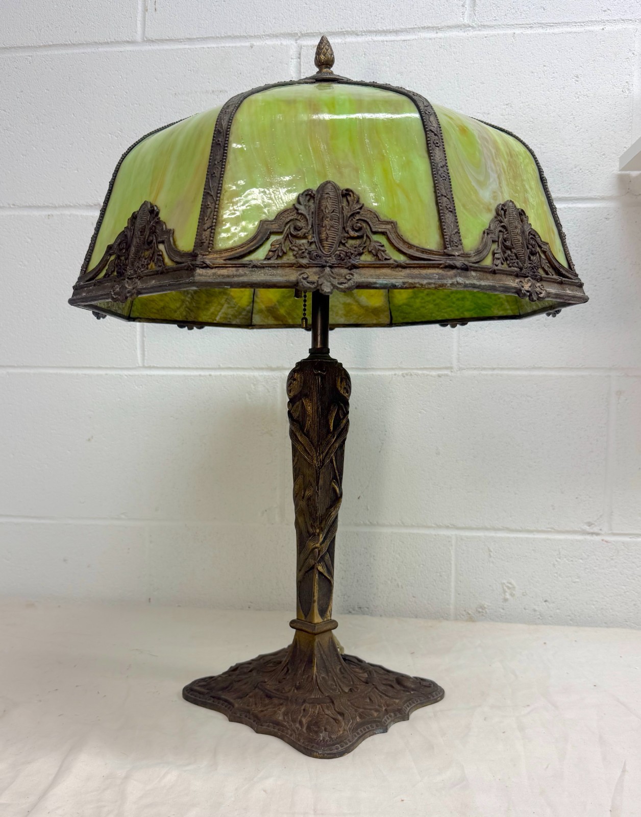 Antique bronze patinated cast iron green slag stained glass electric table lamp