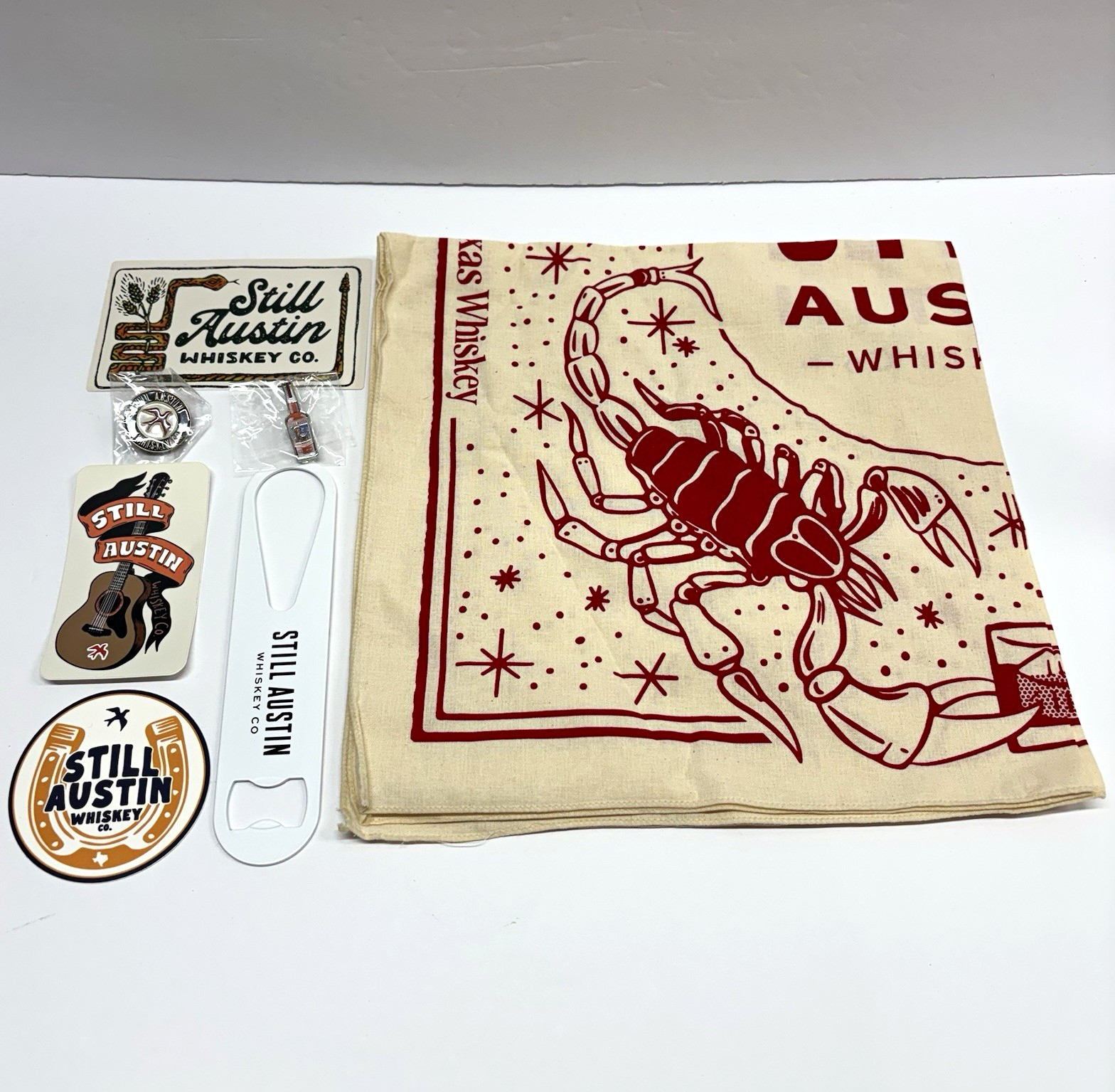 Still Austin Whiskey Co. Distillery Lot: Bandana, Opener, Stickers & Pins
