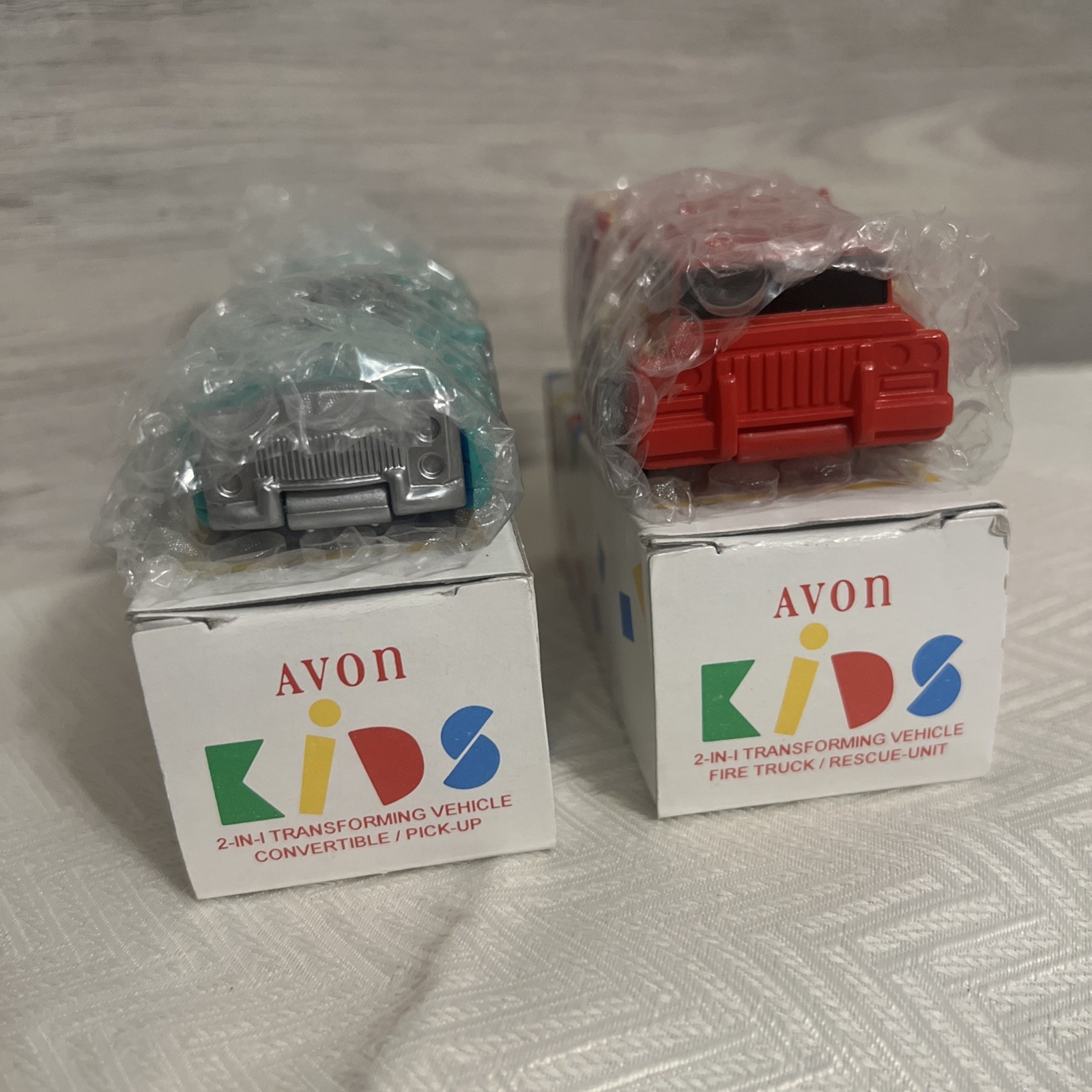 (2) Vtg 1996 Avon 2 in 1 Transforming Vehicles Convertible/Pick Up & Fire Truck