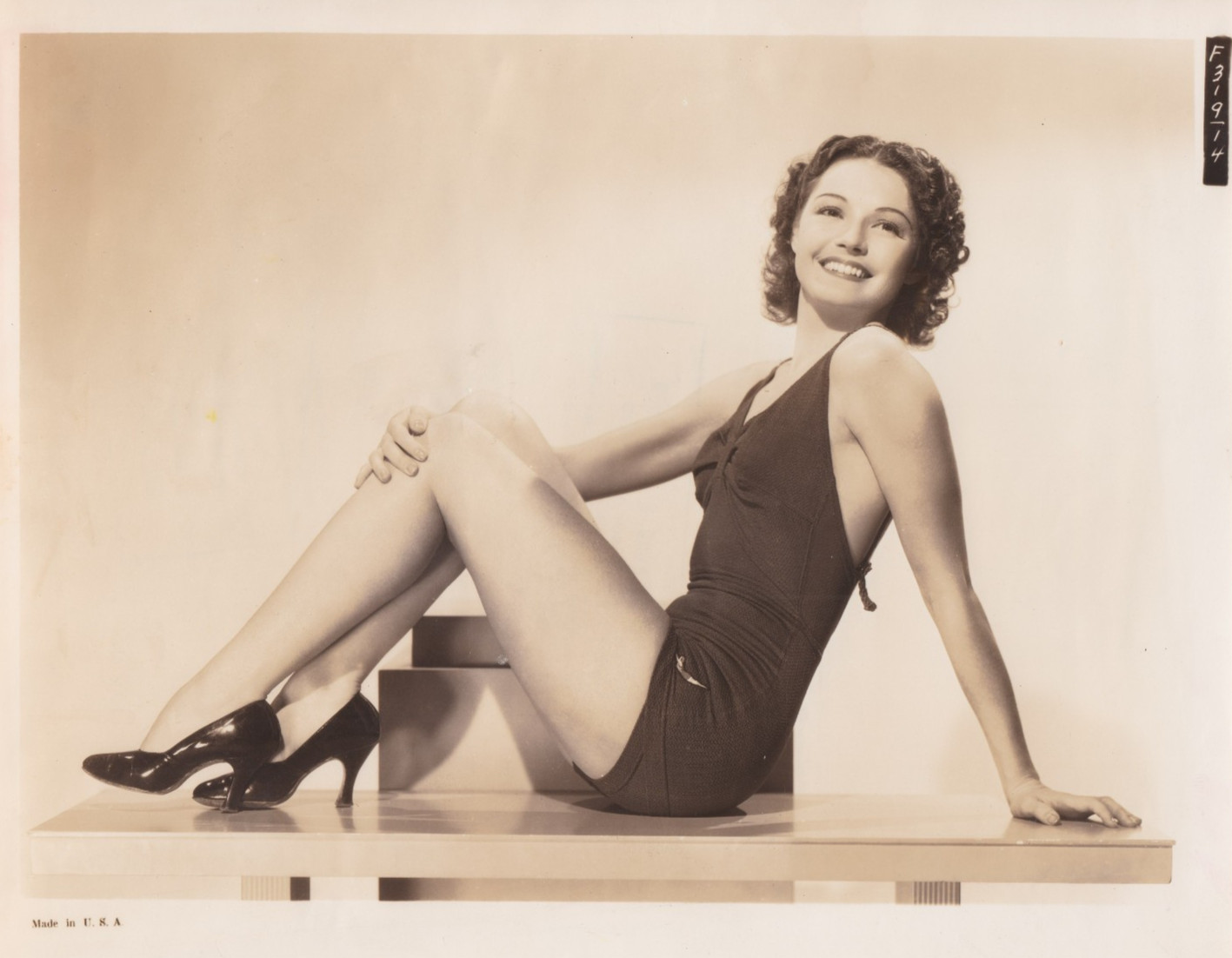 1938 Press Photo Leggy Actress Marjorie Weaver Models Bathing Suit for Fox Film