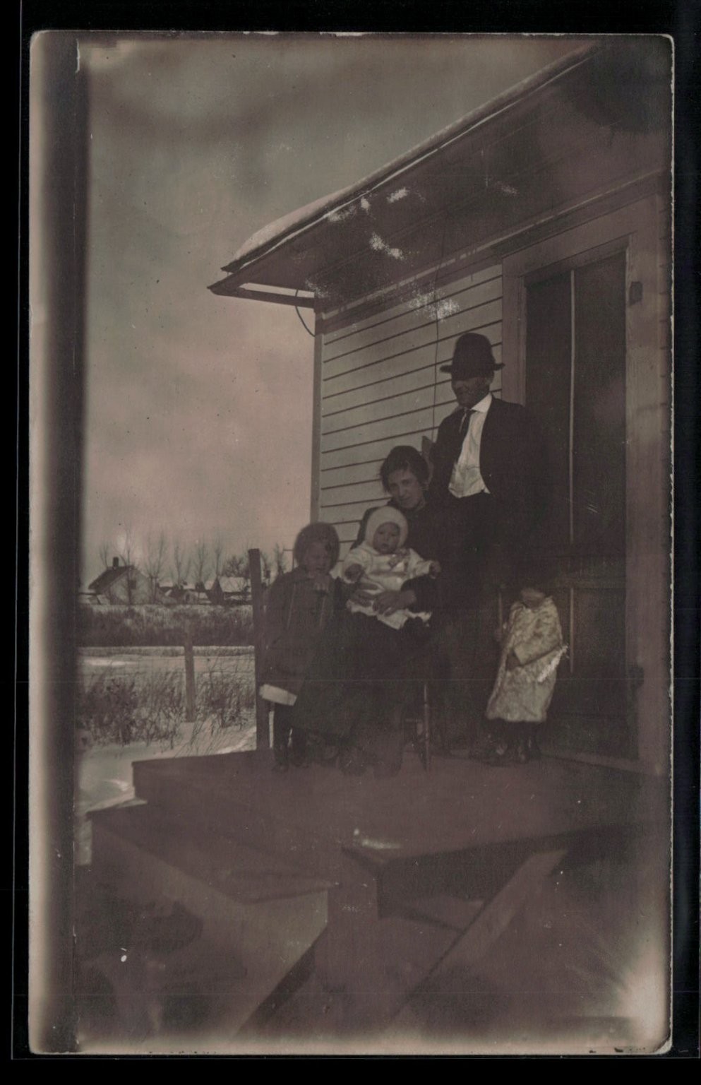 RPPC Family Portrait on Porch Winter Scene Real Photo Postcard c1910s