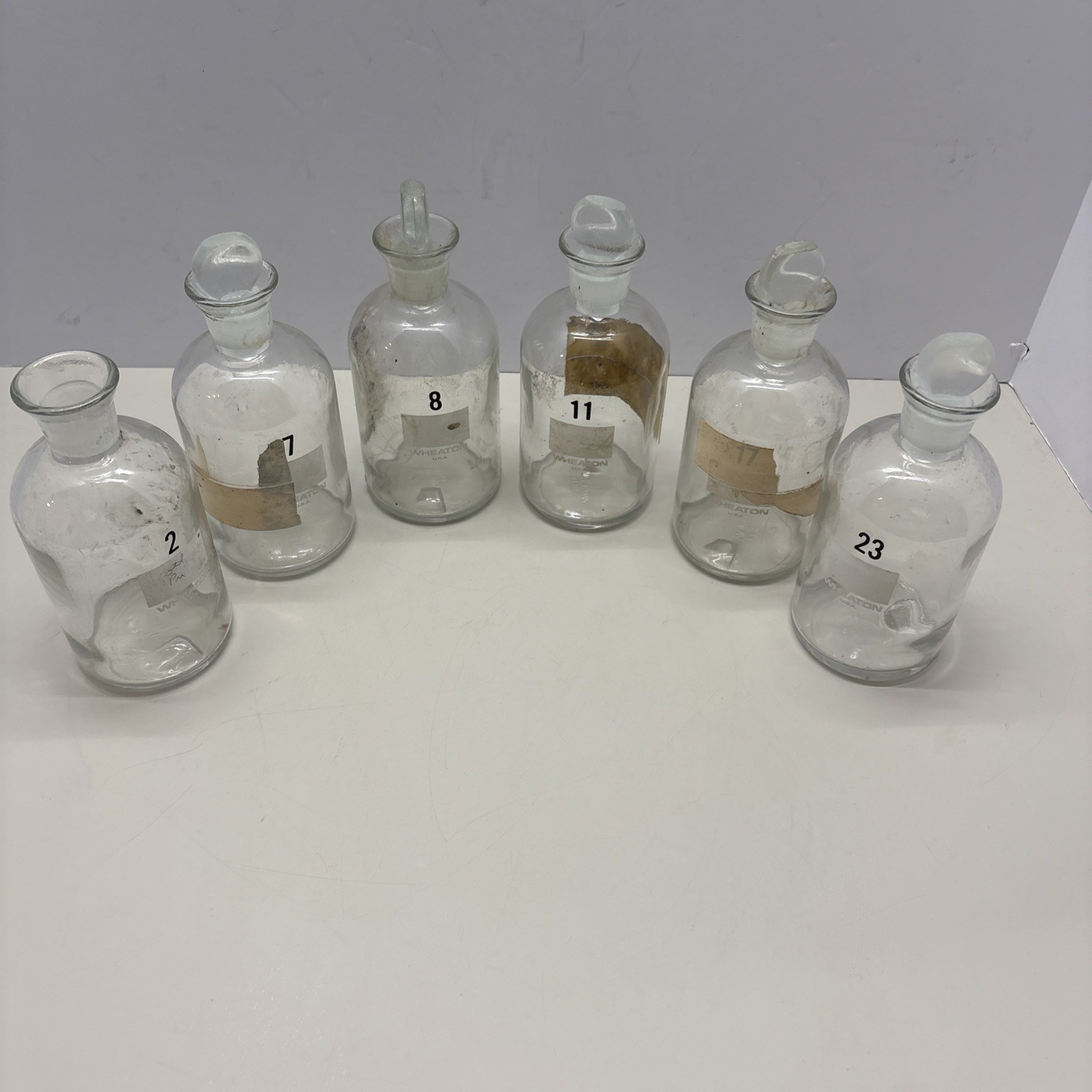 🇺🇸 VTG Clear Glass Apothecary 7 Bottles 6 Stoppers Wheaton Millville NJ. #181