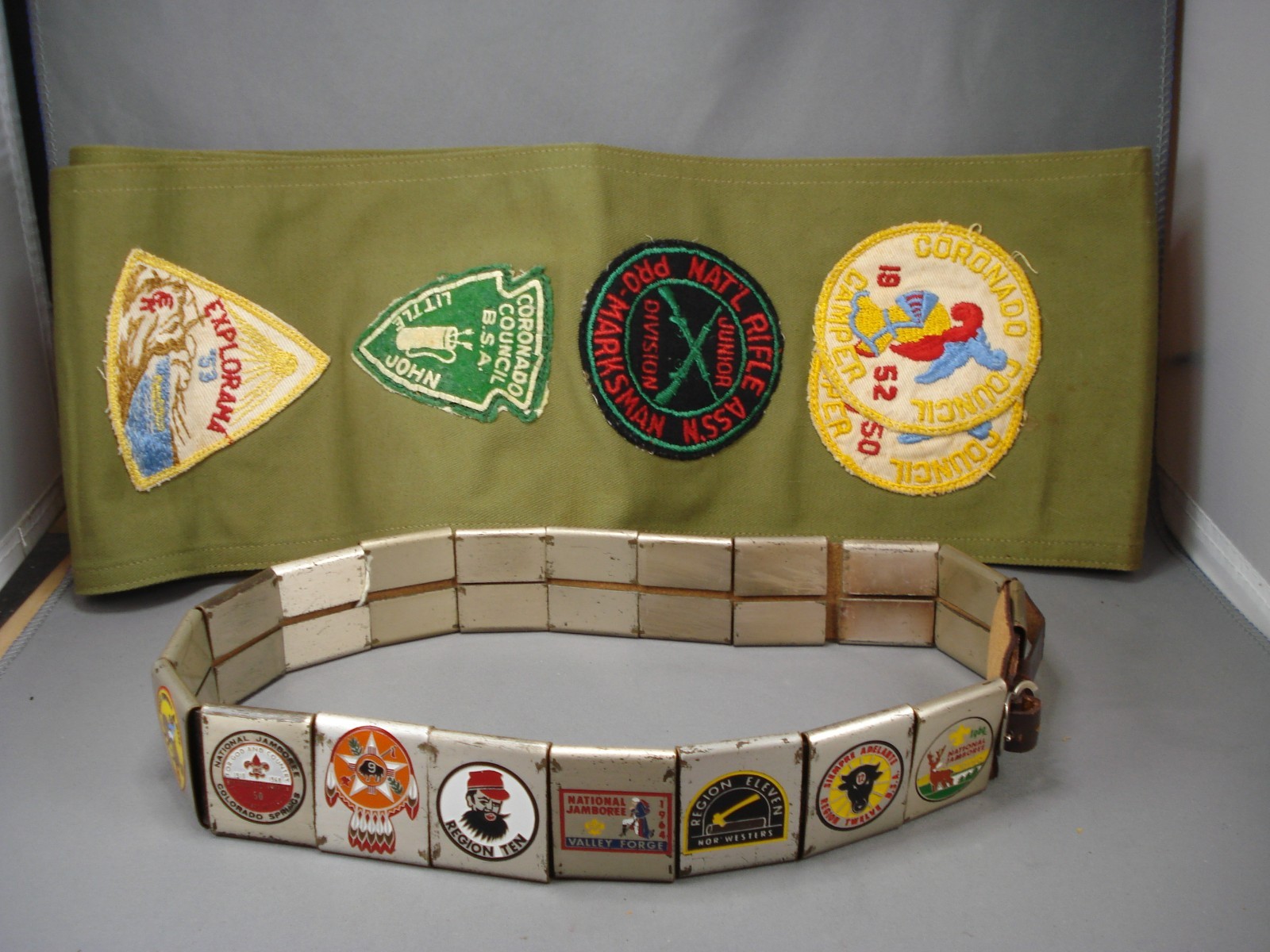HUGE LOT OF 30'S-60'S BOY SCOUT METAL BELT LOOPS AND SASH WITH PATCHES