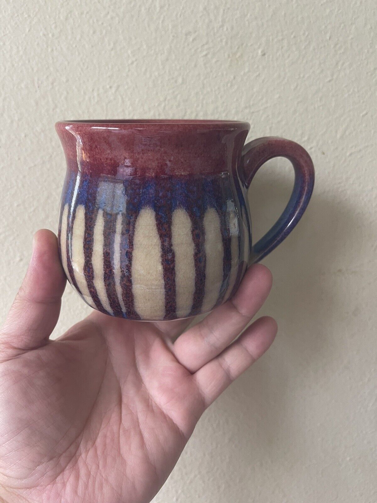 A Pretty Colorful Mug With Artist Signature On It