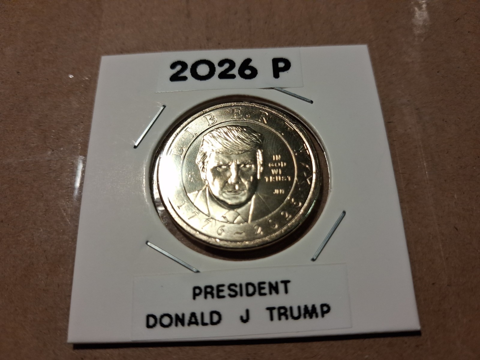PRESIDENT TRUMP 2026 P DOLLAR COIN IN CUSTOM LABELLED 2X2 HOLDERS 