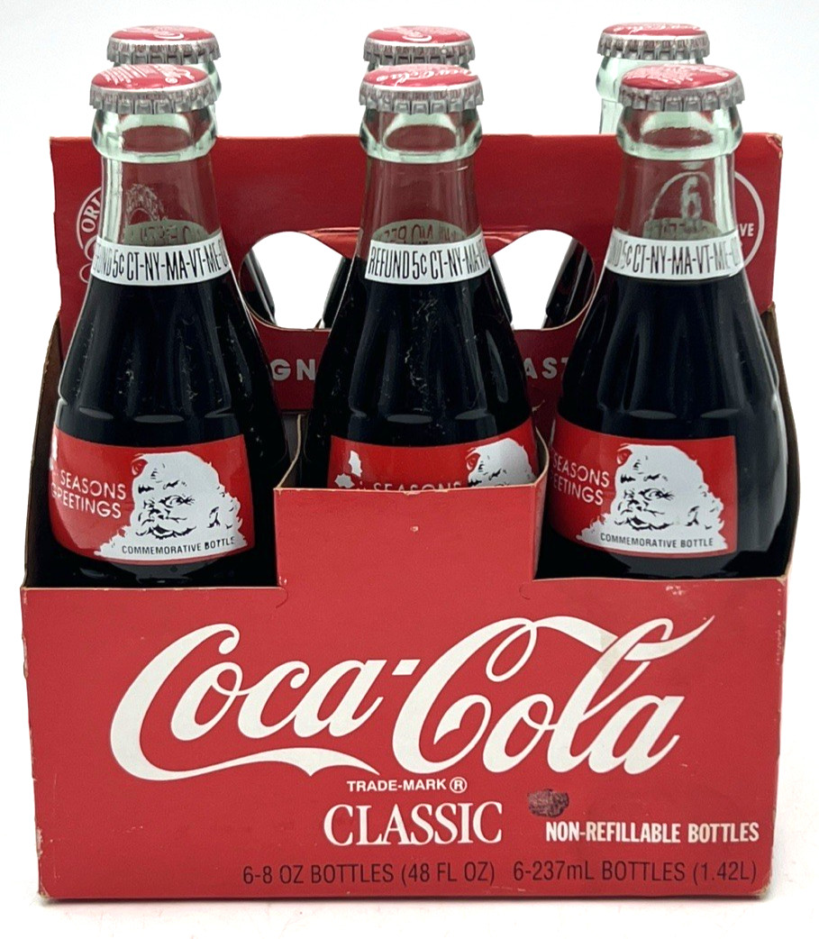 (6) 1991 COCA COLA SEASONS GREETINGS COMMEMORATIVE BOTTLES SEALED 8 OZ & CARRIER