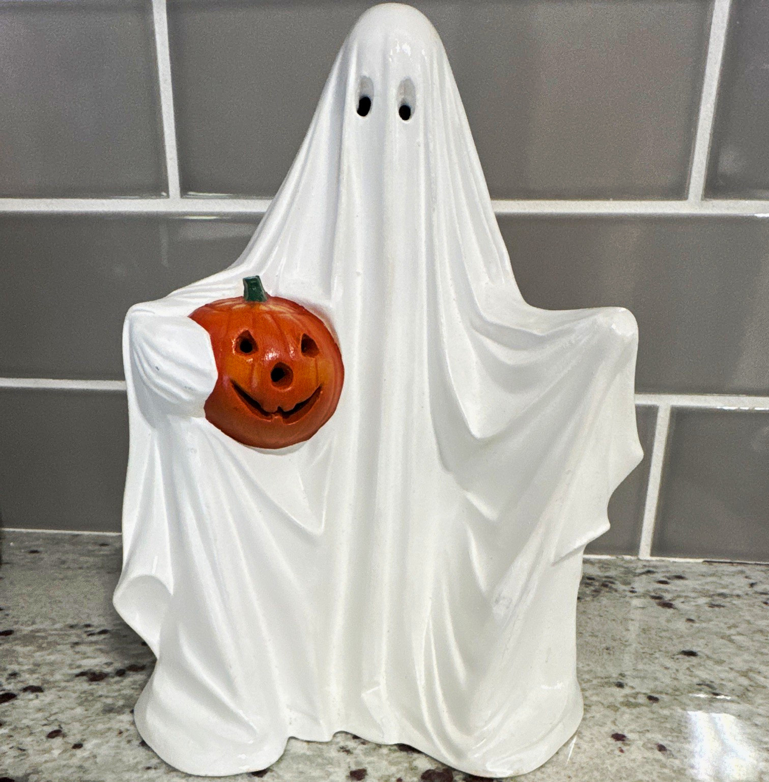 Vintage 1972 Byron Molds ceramic ghost holding pumpkin