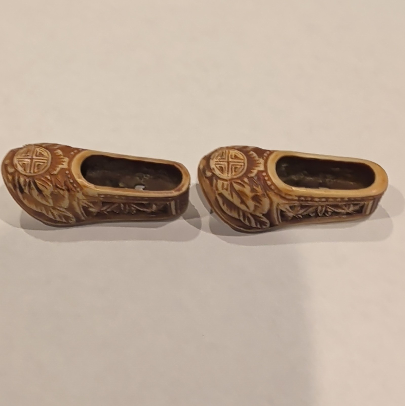Pair of vintage Chinese hand-carved lychee wood miniature shoes