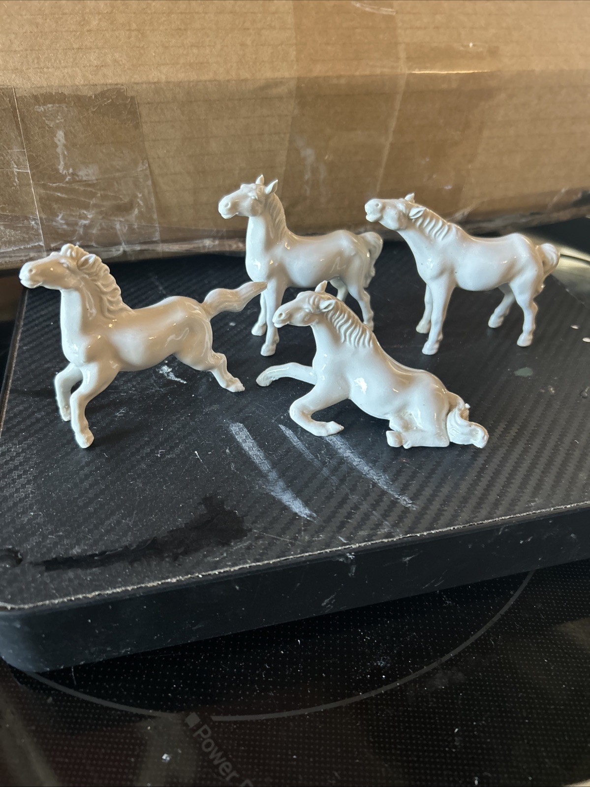 4 VINTAGE  PORCELAIN  MINATURE WHITE HORSES FIGURINES  App 3x3”