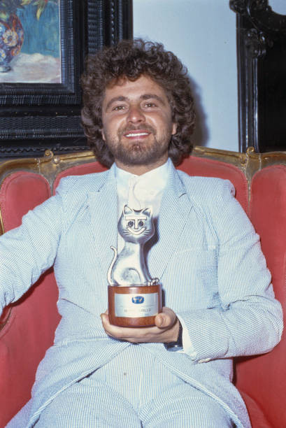 Italian comedian Beppe Grillo posing smiling with Telegatto award - Old Photo Italian comedian Beppe Grillo posing smiling with Telegatto award - Old Photo