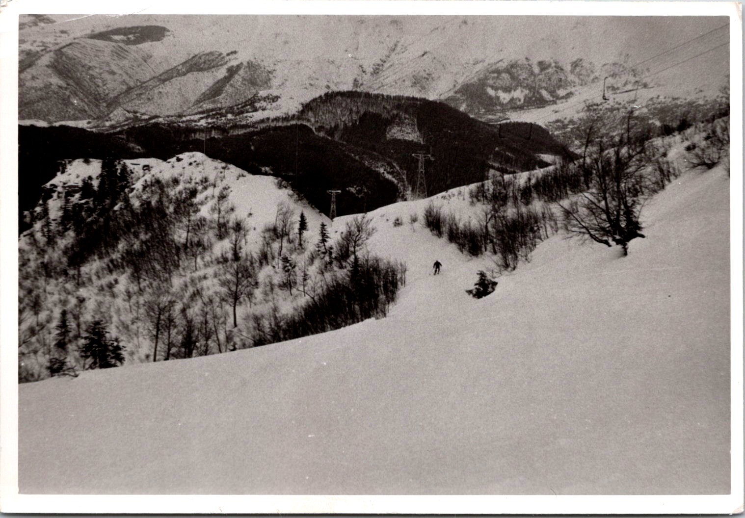 Lone Skier on Snowy Mountain Slopes, 1960s Winter Landscape Snapshot Photo