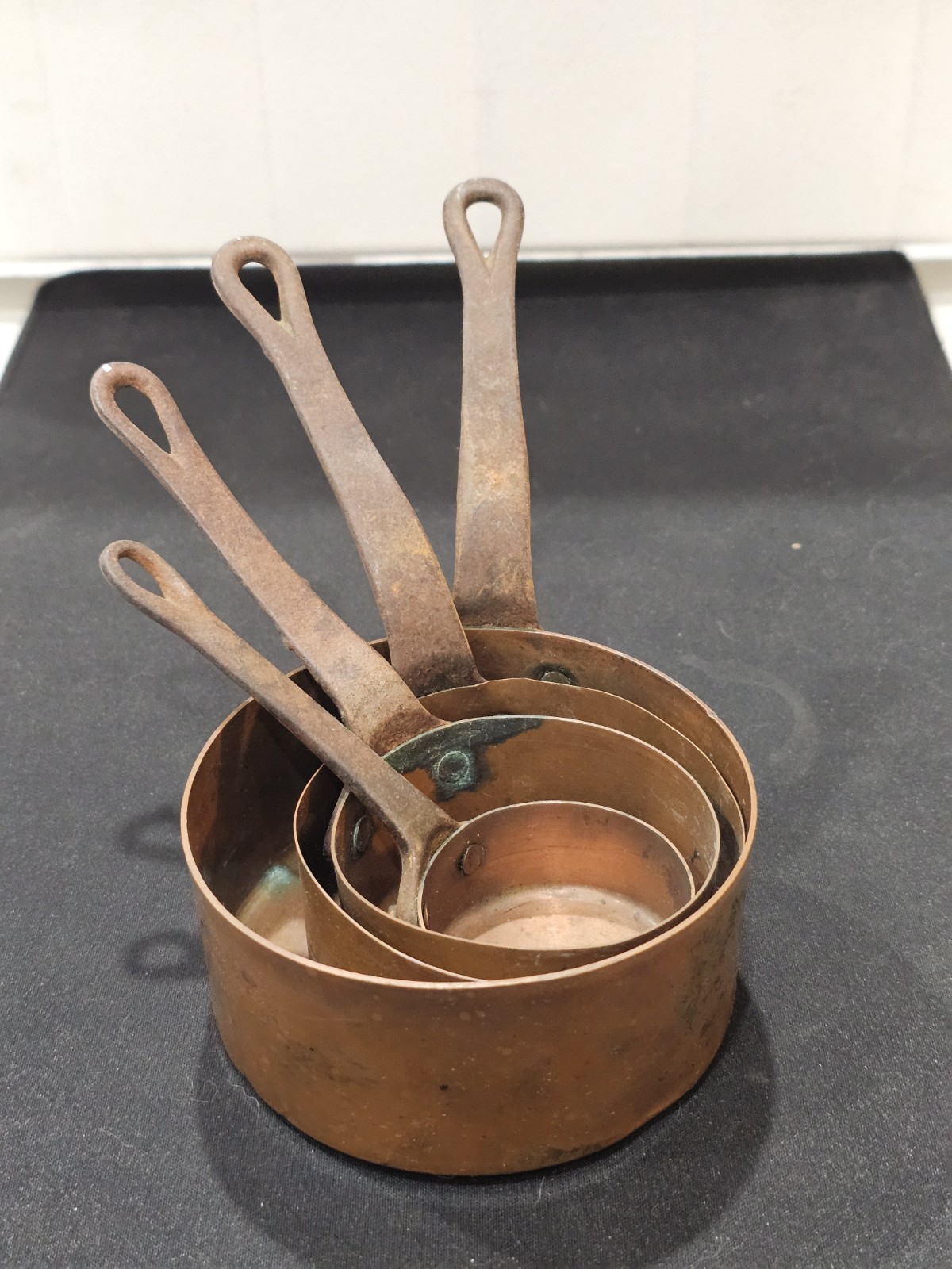 A Set of 4 Vintage French Small Copper Saucepans A lovely Decorative Set. A Set of 4 Vintage French Small Copper Saucepans A lovely Decorative Set.