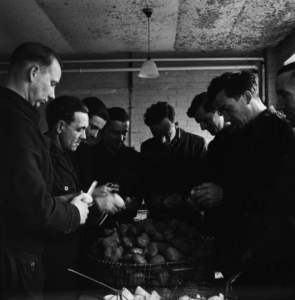 German prisoners of war peel potatoes cookhouse at Wilton Park POW- Old Photo