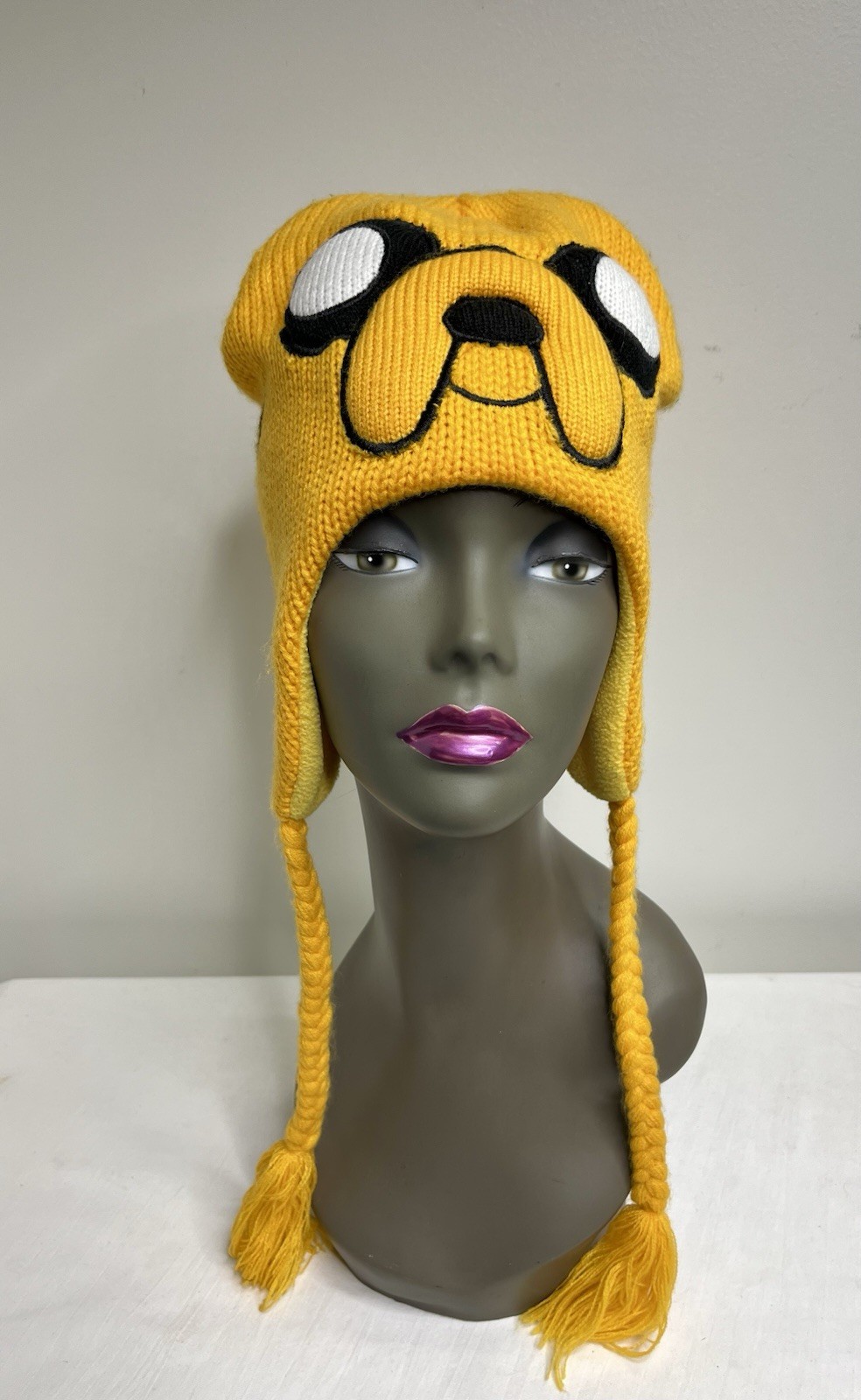 Adventure Time Jake the Dog knit beanie featuring his iconic smiling face