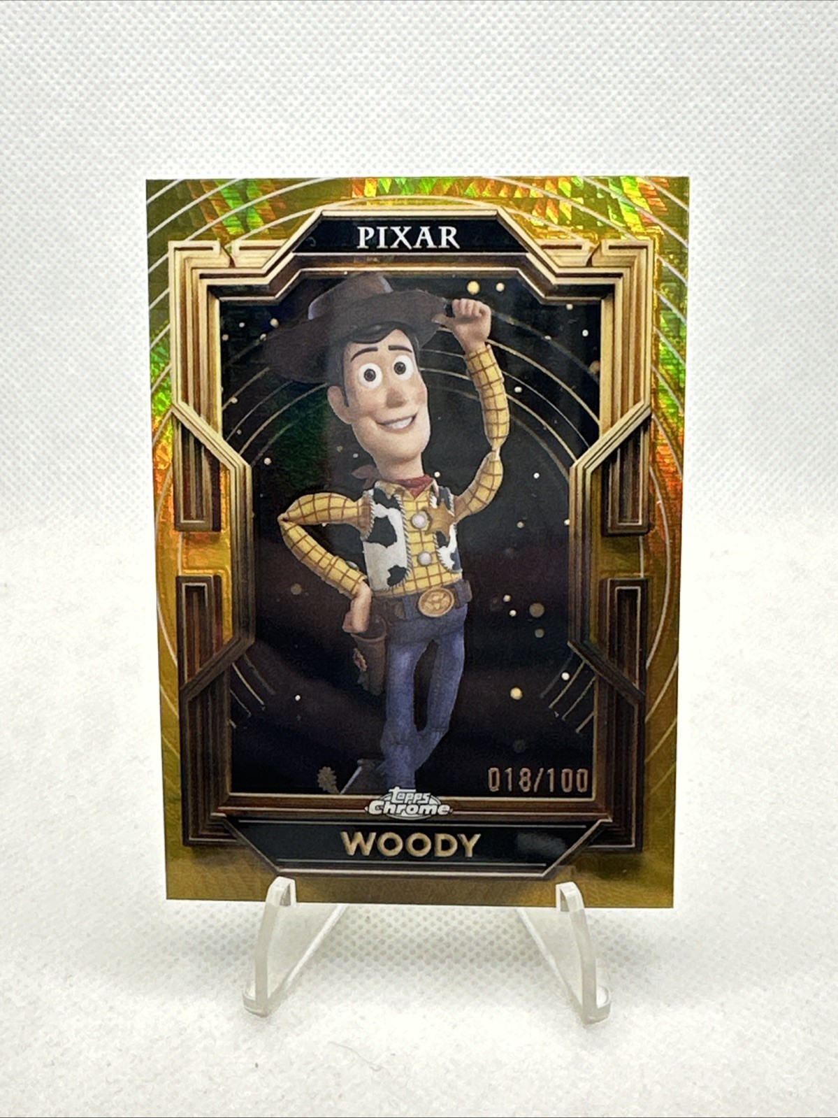 2025 Topps Chrome Disney Pixar Gold #1 Woody /100 (Gold Prism Refractor)