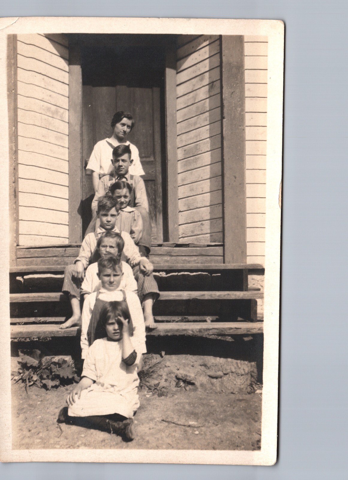 FAMILY OF KIDS CUTE POSE c1910 real photo postcard rppc boys girls fun