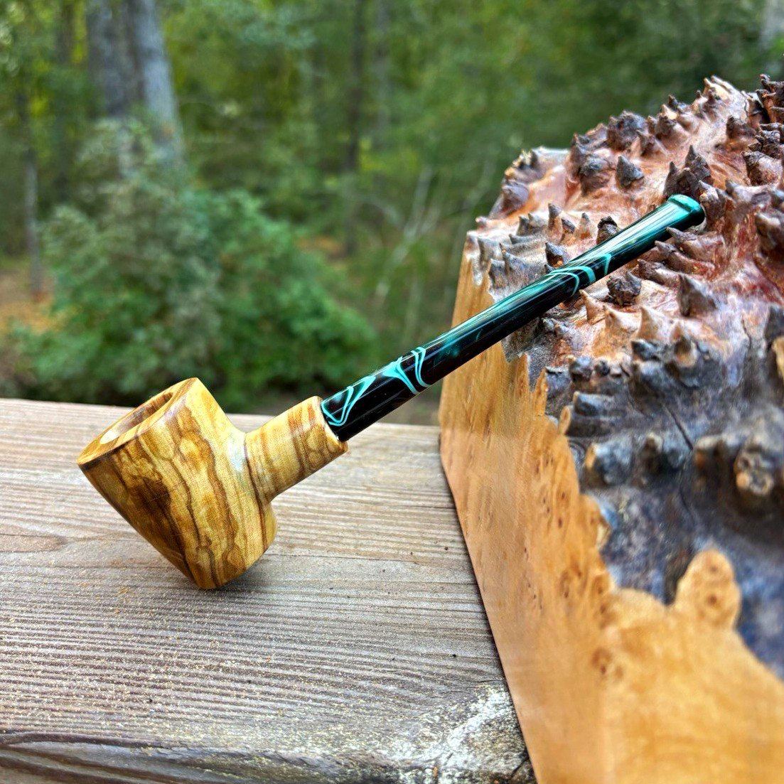 Olive wood Dublin tobacco pipe with straight dark green ripple acrylic stem.