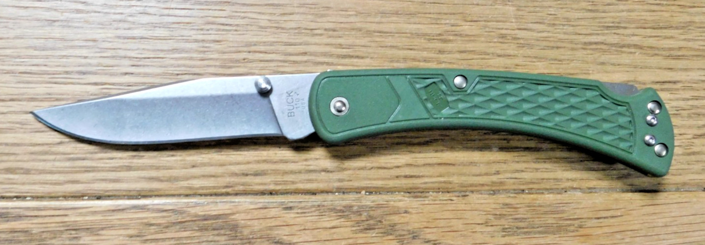 Buck Knive 110 Green New Old Stock Never Sharpened. Buck Knive 110 Green New Old Stock Never Sharpened.
