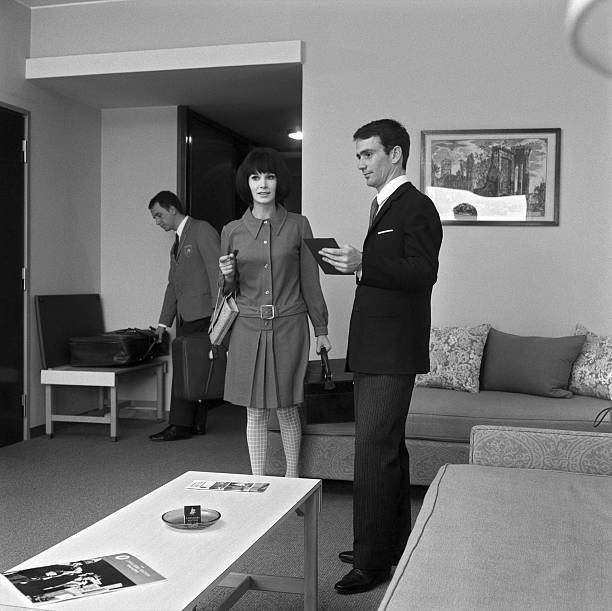 The hotel manager illustrating comforts of room a guest Italy 1960s Old Photo