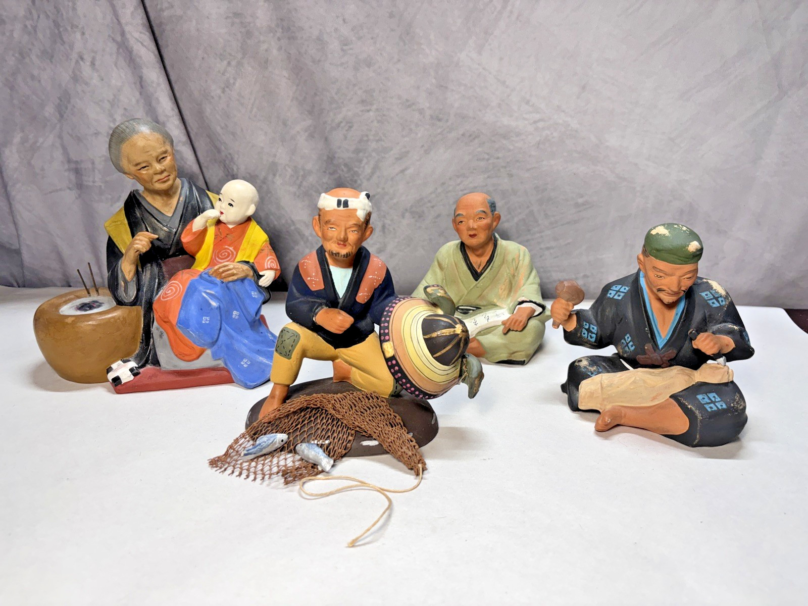 Four Vintage Hakata Urasaki Clay Figurines