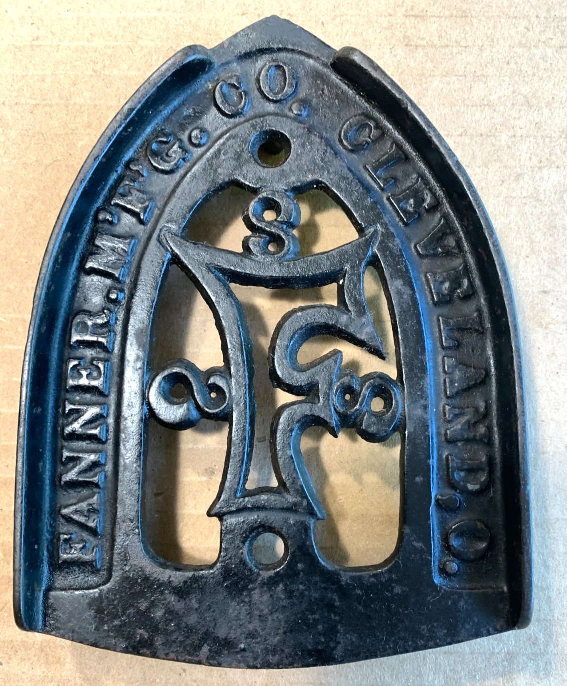 Antique Early Advertising ART Cast Iron Sad Trivet Stand Holder FANNER MFG OHIO