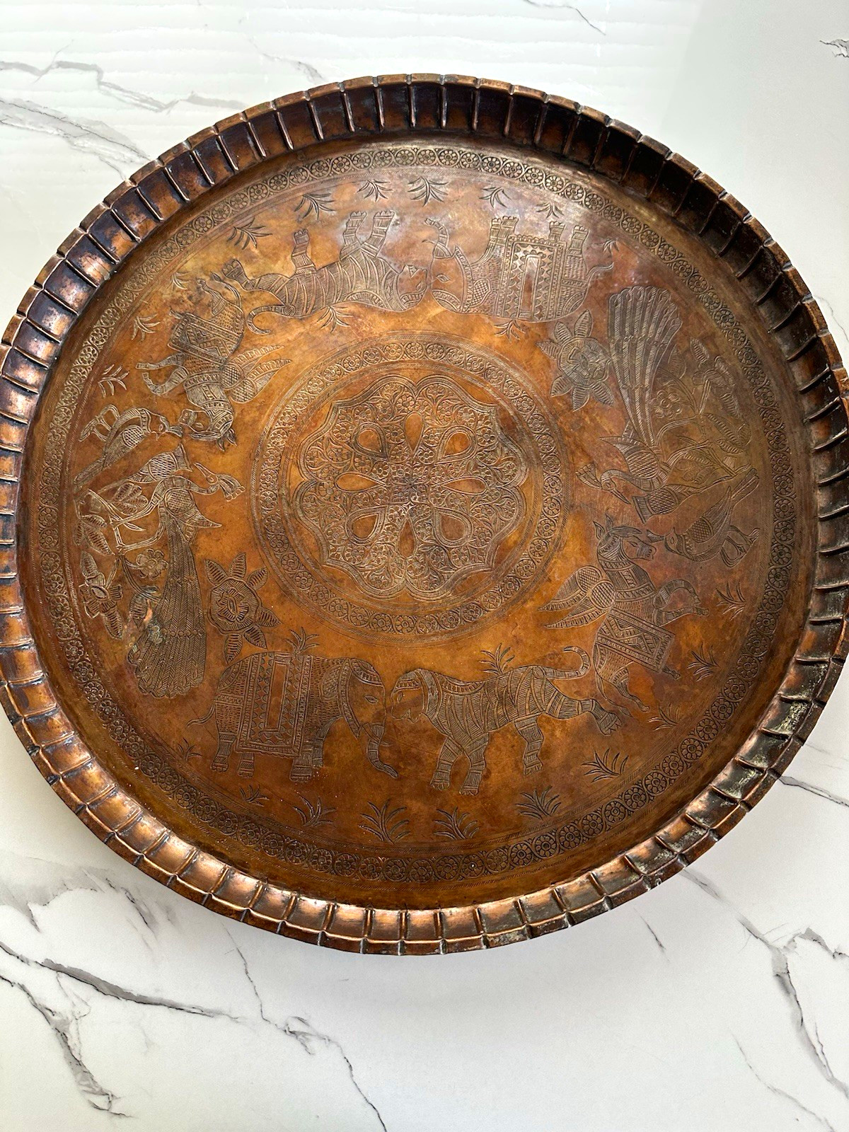 An antique Persian (Qajar dynasty) copper tray