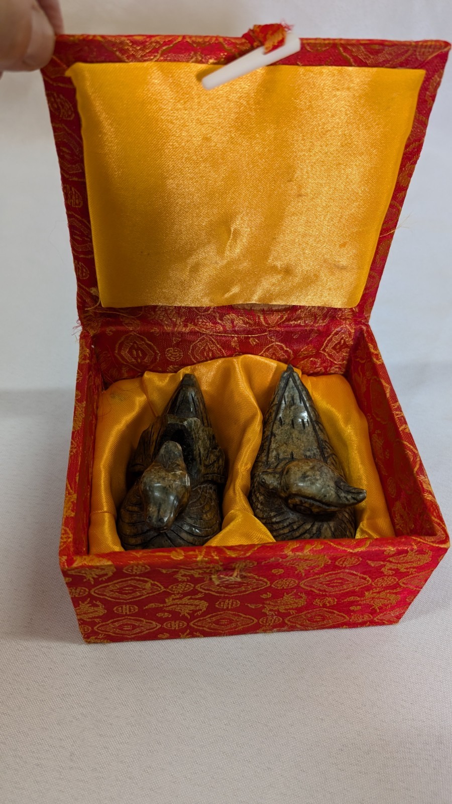 2 Chinese vintage stone carved mandarin ducks resting inside a traditional box 2 Chinese vintage stone carved mandarin ducks resting inside a traditional box