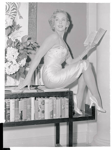 Leigh Snowden Sitting with Book 1955 Photo - Sex appeal isn't all Leigh Snowden