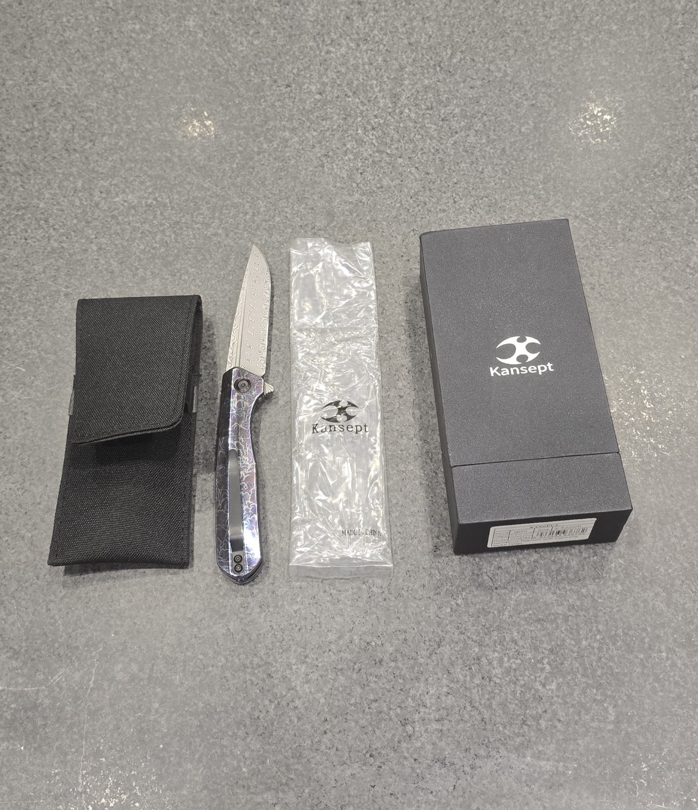 Kansept hel Qilin Damascus steel blade lighting strike anodized titanium handle 