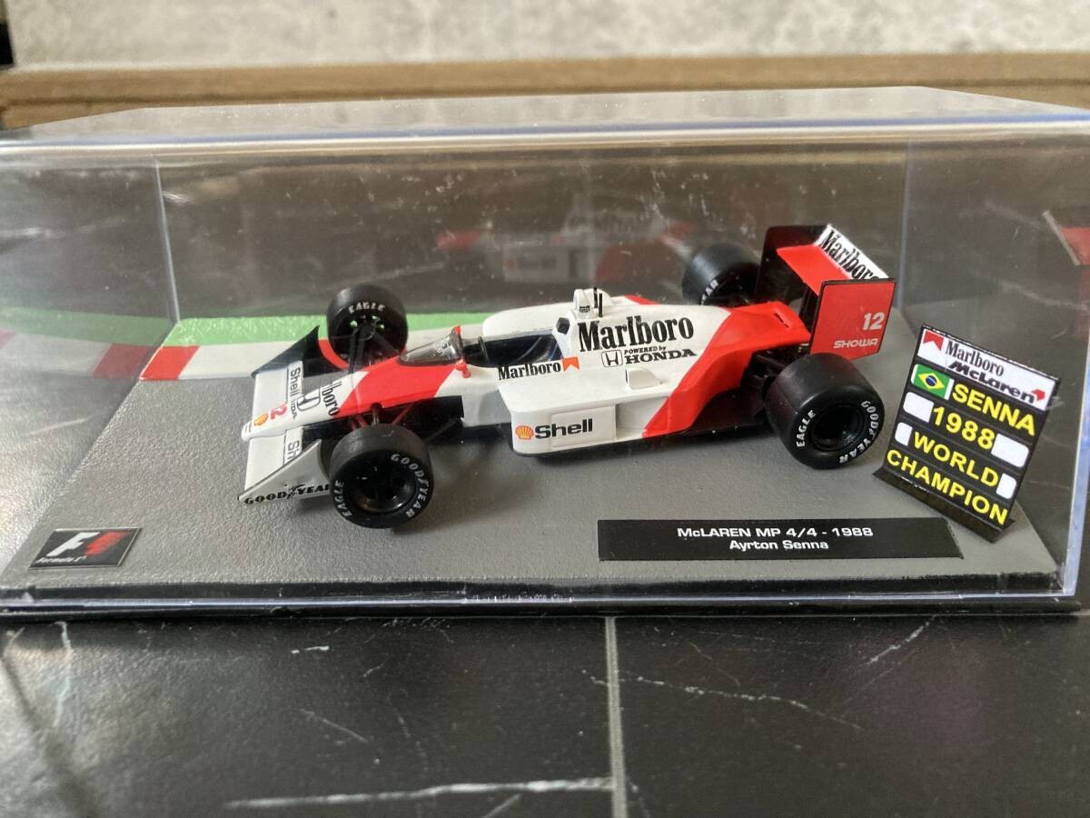 McLaren Honda MP4/4 Marlboro Edition with Champion Board Ayrton Senna 1988 1/43