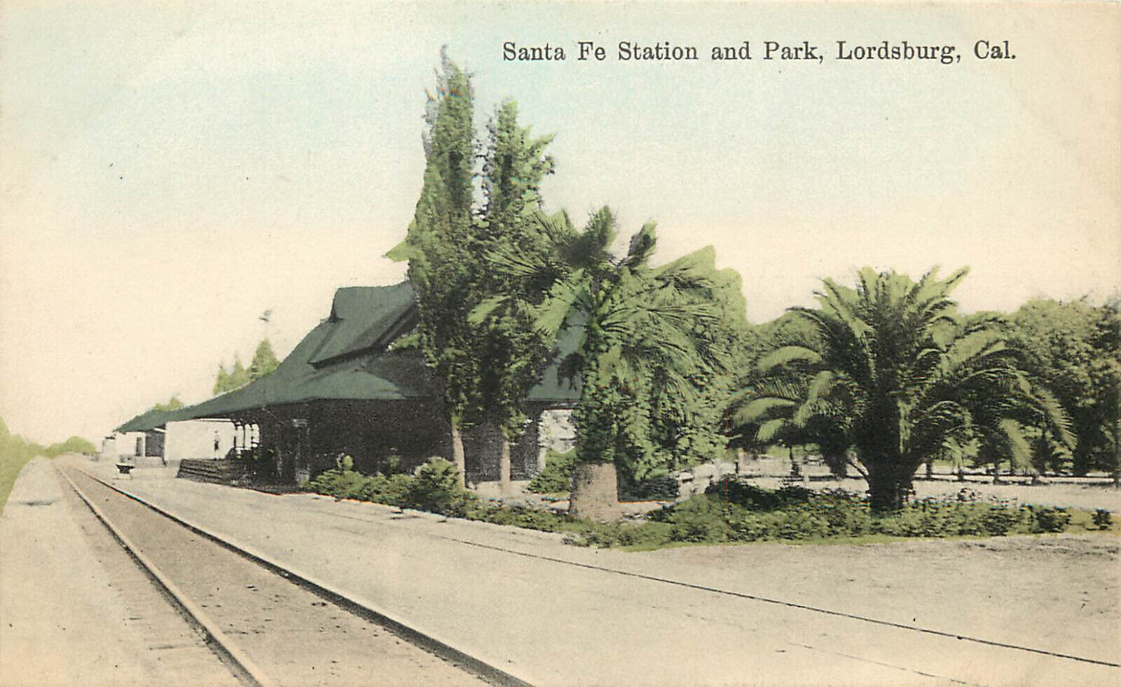 Hand Colored Postcard Santa Fe Depot Train Station & Park Lordsburg La Verne CA
