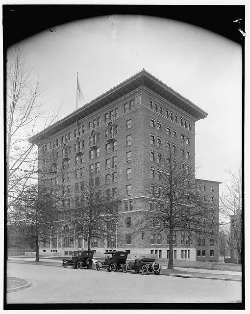Photo:Historic Multi Story Brick Building with Vintage Automobiles 1910s