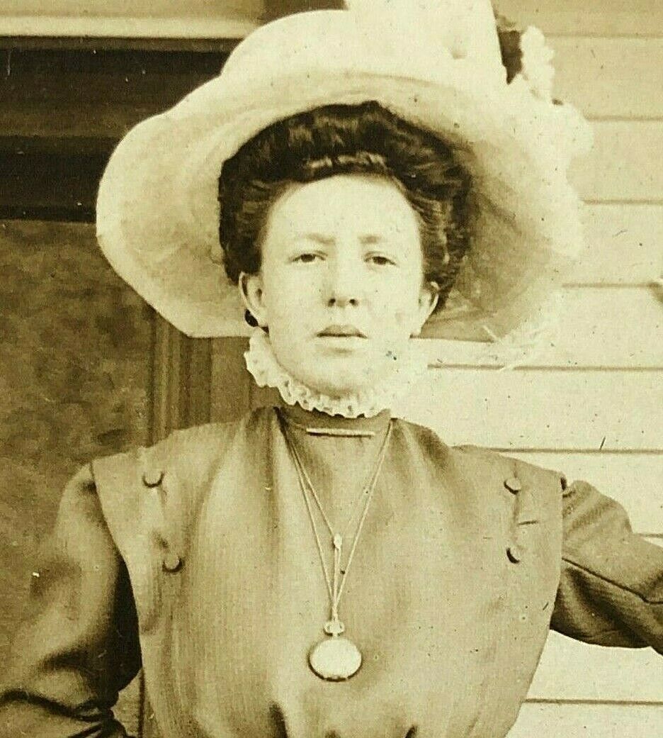 RPPC Postcard  BEAUTIFUL Fierce Woman Fancy Hat Locket Jewelry Victorian House 