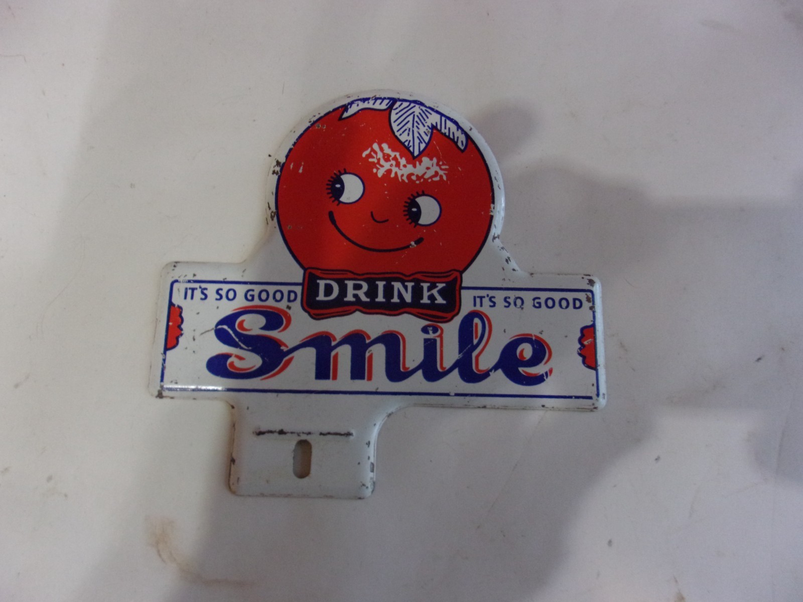 NICE OLD SMILE DRINK ORANGE LICENSE PLATE TOPPER..SODA AND AUTOMOBILIA..