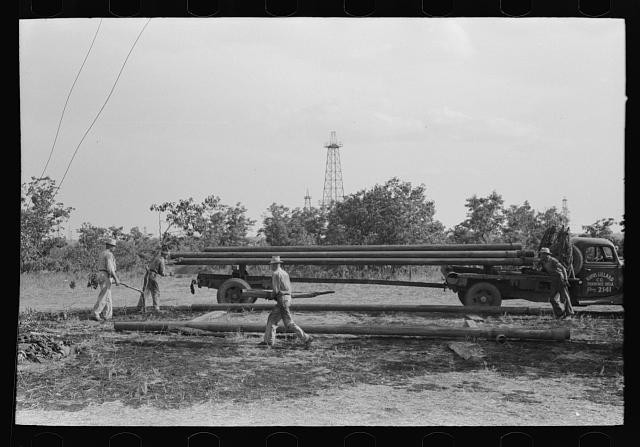 Photo:Seminole Oklahoma Oil Field Workers Truck Pipes 1930s FSA